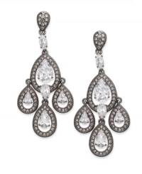 Elegance takes a dark turn in this pair of chandelier earrings from Eliot Danori. Crafted from hematite-tone brass, the earrings make stunning use of shadowy hues with crystal and cubic zirconia (5-9/10 ct. t.w.) accents. Approximate drop: 1-1/2 inches. Elegance takes a dark turn in this pair of chandelier earrings from Eliot Danori. Crafted from hematite-tone brass, the earrings make stunning use of shadowy hues with crystal and cubic zirconia (5-9/10 ct. t.w.) accents. Approximate drop: 1-1/2 inches.