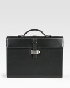 Single-gusset briefcase made of full-grain calfskin leather with a full, jacquard lining, ruthenium-plated metal accents and a unique lock closure.Top handleFlap front latch closureLeather14W x 10¼H x 4DMade in Italy