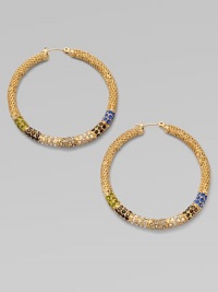 Richly textured hoops set with a stunning spectrum of colored glass stones.GlassBrassDiameter, about 1¾Post backImported Richly textured hoops set with a stunning spectrum of colored glass stones.GlassBrassDiameter, about 1¾Post backImported