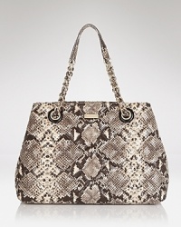 This kate spade new york tote blends practical allure with on-trend panache, crafted in snake embossed leather with carry-it-all proportions. This kate spade new york tote blends practical allure with on-trend panache, crafted in snake embossed leather with carry-it-all proportions.