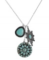 A real charmer. This Lucky Brand necklace catches the eye with its semi-precious, reconstituted turquoise stones, placed upon three dangling metal charms. Crafted in silver tone mixed metal. Approximate length: 20 inches + 2-inch extender. Approximate drop: 2-2/3 inches.