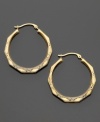 You'll love the vintage-style engraving on these beautiful hoops crafted in 14k gold. Approximate diameter: 3/4 inch.