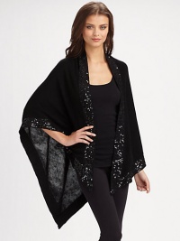 Fine gauge knit with hand beaded sequin border.One size fits most About 56 X 72 70% acrylic/30% wool Dry clean Imported Fine gauge knit with hand beaded sequin border.One size fits most About 56 X 72 70% acrylic/30% wool Dry clean Imported