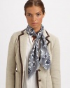 A charming floral print and zig-zag fringe add unique style to a wool scarf.WoolAbout 45 X 45Dry cleanImported