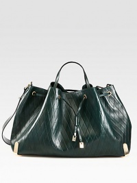 A slouchy carryall of diamond-embossed leather, finished with a chic drawstring tie and versatile strap. Double top handles, 6 dropAdjustable detachable shoulder strap, 12½-19½ dropTop drawstring closureDetachable zipper leather pouch One inside zip pocketCotton lining19W X 11½H X 7¼DMade in Italy A slouchy carryall of diamond-embossed leather, finished with a chic drawstring tie and versatile strap. Double top handles, 6 dropAdjustable detachable shoulder strap, 12½-19½ dropTop drawstring closureDetachable zipper leather pouch One inside zip pocketCotton lining19W X 11½H X 7¼DMade in Italy