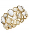 Freshen up with a clean white color palette. Charter Club's chic cluster bracelet features bright white plastic beading set in gold tone mixed metal. Bracelet stretches to fit wrist. Approximate diameter: 2-1/4 inches.