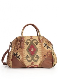 THE LOOKDouble leather-and-fabric top handlesRemovable, adjustable crossbody strapTop zip closureTapestry fabric construction with leather trimLogo-embossed leather luggage tagOne outside zip pocketProtective metal feetTwo inside open pocketsOne inside zip pocketInside logo detailTHE MEASUREMENTDouble top handles, 7½Adjustable crossbody strap THE LOOKDouble leather-and-fabric top handlesRemovable, adjustable crossbody strapTop zip closureTapestry fabric construction with leather trimLogo-embossed leather luggage tagOne outside zip pocketProtective metal feetTwo inside open pocketsOne inside zip pocketInside logo detailTHE MEASUREMENTDouble top handles, 7½Adjustable crossbody strap