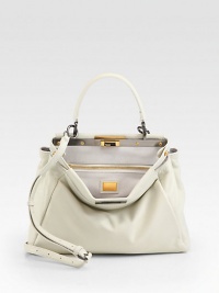 A classic ladylike silhouette in ultra supple leather with a framed top and decadent suede lining.Top handle, 4 drop Adjustable detachable shoulder strap 15-26 drop Turnlock closure Protective metal feet One inside zip pocket Two center compartments Suede lining 13W X 9½H X 4D Made in Italy A classic ladylike silhouette in ultra supple leather with a framed top and decadent suede lining.Top handle, 4 drop Adjustable detachable shoulder strap 15-26 drop Turnlock closure Protective metal feet One inside zip pocket Two center compartments Suede lining 13W X 9½H X 4D Made in Italy