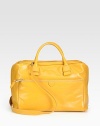 A bold leather style in a simply chic design with a versatile detachable strap.Double top handles, 5 dropDetachable shoulder strap, 20½ dropTop zip closureProtective metal feetOne outside zip pocketOne inside zip pocketTwo inside open pocketsCotton lining14W X 10H X 8½DImported