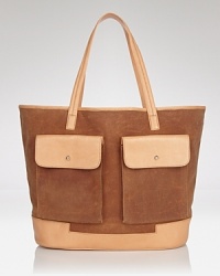 Hunter's large tote boasts the label's practical design and timeless look. In canvas and leather, the carryall stows your essentials for daily jaunts or rustic weekends away. Hunter's large tote boasts the label's practical design and timeless look. In canvas and leather, the carryall stows your essentials for daily jaunts or rustic weekends away.