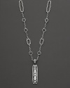 John Hardy's tribal-influenced station necklace features rectangle and circle stations and a carved pendant at the base.