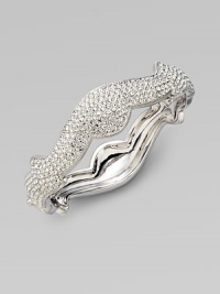 A beautifully curvy design in plated rhodium. Brass Hinged, box and tongue closure Diameter, about 2¼ Width, about ½ Imported A beautifully curvy design in plated rhodium. Brass Hinged, box and tongue closure Diameter, about 2¼ Width, about ½ Imported