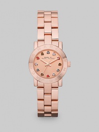 A warm rose goldtone ion-plated stainless steel style with multicolored stone markers for a pop of color. Quartz movementWater resistant to 5 ATMRound rose goldtone ion-plated stainless steel case, 26mm (1)Logo etched bezelRose goldtone dialMulticolored glass stone hour markersSecond hand Rose goldtone ion-plated stainless steel link braceletImported A warm rose goldtone ion-plated stainless steel style with multicolored stone markers for a pop of color. Quartz movementWater resistant to 5 ATMRound rose goldtone ion-plated stainless steel case, 26mm (1)Logo etched bezelRose goldtone dialMulticolored glass stone hour markersSecond hand Rose goldtone ion-plated stainless steel link braceletImported