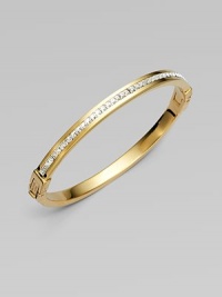A narrow design that sparkles with a row of dazzling clear rhinestones. RhinestonesGoldtone steelDiameter, about 2¾Hinged, push lock closureImported A narrow design that sparkles with a row of dazzling clear rhinestones. RhinestonesGoldtone steelDiameter, about 2¾Hinged, push lock closureImported