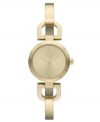 DKNY takes a ladylike turn with this golden bangle watch.