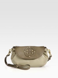 The perfect style for all your essentials, this leather design features a detachable crossbody strap and chic, drawstring detail.Detachable, adjustable shoulder strap, 19.5-21.5 dropMagnetic flap closureDrawstringRivet accented leather logo detailTwo inside open pocketsFully lined11W X 7H X 3DImported The perfect style for all your essentials, this leather design features a detachable crossbody strap and chic, drawstring detail.Detachable, adjustable shoulder strap, 19.5-21.5 dropMagnetic flap closureDrawstringRivet accented leather logo detailTwo inside open pocketsFully lined11W X 7H X 3DImported