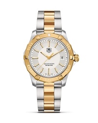 The Aquaracer from TAG Heuer features all six of TAG Heuer's features of a professional sports watch, including sapphire crystal, luminescent markers, screw-in crown, unidirectional rotating bezel, a double safety clasp and 300M water resistance. This model features 18K. gold and steel. The Aquaracer from TAG Heuer features all six of TAG Heuer's features of a professional sports watch, including sapphire crystal, luminescent markers, screw-in crown, unidirectional rotating bezel, a double safety clasp and 300M water resistance. This model features 18K. gold and steel.
