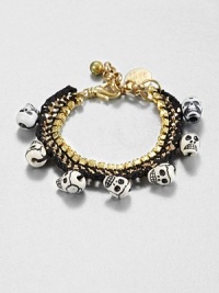 Inspired by cultures and travels around the world, this skull and thread accented link chain design is sure to turn heads. Goldtone brassPolyester threadGlass stonesCeramic skullsLength, about 6Lobster clasp closureMade in USA Inspired by cultures and travels around the world, this skull and thread accented link chain design is sure to turn heads. Goldtone brassPolyester threadGlass stonesCeramic skullsLength, about 6Lobster clasp closureMade in USA