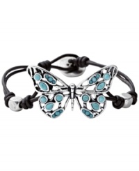 A naturally beauty. The intricate silver tone openwork butterfly decoration on this mixed metal Fossil bracelet really stands out against the chocolate leather cord wrist wrap. Semi-precious turquoise stones add a pretty dose of color. Approximate length: 7-3/4 inches. A naturally beauty. The intricate silver tone openwork butterfly decoration on this mixed metal Fossil bracelet really stands out against the chocolate leather cord wrist wrap. Semi-precious turquoise stones add a pretty dose of color. Approximate length: 7-3/4 inches.