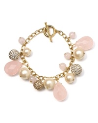 Reach for some pretty arm candy with this bracelet from Carolee, crafted of gold plate, rose quartz and glass pearl beads. Reach for some pretty arm candy with this bracelet from Carolee, crafted of gold plate, rose quartz and glass pearl beads.