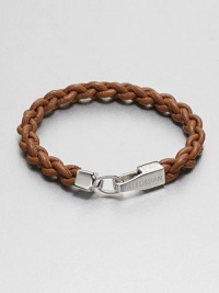 A braided strand of genuine leather is offset by a shiny, sterling silver clasp.LeatherSterling silverAbout 2½ diam.Made in the United Kingdom