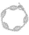 Traditionally glamorous. Carolee combines simulated pearls and sparkling glass accents into an intricate marquise-shaped pattern on this gorgeous toggle bracelet. Crafted in silver tone mixed metal. Approximate length: 7-1/4 inches.