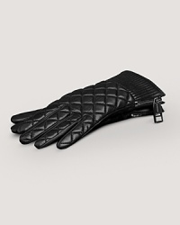 Chic quilted lambskin gloves with soft cotton lining and zipper detail at wrist. Chic quilted lambskin gloves with soft cotton lining and zipper detail at wrist.