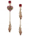 Light as a feather and all heart. Betsey Johnson's funky mismatched earrings combine a fuchsia heart with love graphic, gold tone feathers with pink-colored crystal accents, gold tone chains and a fuchsia-colored crystal accent at post. Set in antiqued gold tone mixed metal. Approximate drop: 3 inches.