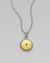 From the Shield Collection. An aptly named disc pendant of hammered 24k gold sits in a richly granulated frame of sterling silver with a faceted black spinel stone at its center.Black spinelSterling silver and 24k yellow goldAdjustable chain length, about 16-18Pendant diameter, about ¾Hook claspImported