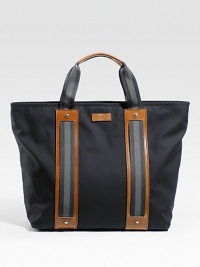 Cotton tote with signature web detail and leather trim. Zip top closure Double handles Leather bottom feet Includes detachable pouch with zip closure Interior zip, cell phone and PDA pockets 18W X 15H X 6D Made in Italy Cotton tote with signature web detail and leather trim. Zip top closure Double handles Leather bottom feet Includes detachable pouch with zip closure Interior zip, cell phone and PDA pockets 18W X 15H X 6D Made in Italy