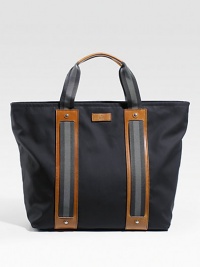 Cotton tote with signature web detail and leather trim. Zip top closure Double handles Leather bottom feet Includes detachable pouch with zip closure Interior zip, cell phone and PDA pockets 18W X 15H X 6D Made in Italy 