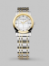 A sturdy stainless steel timepiece accented with diamonds adds a little everyday luxury to your watch collection. Quartz movement Round stainless face with golden bezel Diamond index markers, tcw .06 Day/date display Round case, 28mm, 1.1 Check-inspired two-tone bracelet Bracelet width, 16mm, 0.63 Imported A sturdy stainless steel timepiece accented with diamonds adds a little everyday luxury to your watch collection. Quartz movement Round stainless face with golden bezel Diamond index markers, tcw .06 Day/date display Round case, 28mm, 1.1 Check-inspired two-tone bracelet Bracelet width, 16mm, 0.63 Imported
