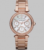 From the Parker Collection. Truly sparkle in this technical timepiece with Swarovski crystal accents. Quartz movementWater resistant to 10 ATMRound rose goldtone stainless steel case, 33mm (1.3) Swarovski crystal accented bezelSilvertone dialNumeric and Swarovski crystal hour markersThree multi-function sub-dialsSecond hand Rose goldtone stainless steel link braceletImported