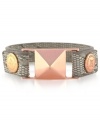 Make a fierce fashion statement. BCBGeneration's PVC snap bracelet features a neutral colored snake-skin pattern with accents crafted from rose gold-tone mixed metal, including a bold pyramid stud. Approximate length: 8 inches.