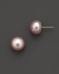 Cultured, pink freshwater pearl stud earrings. Cultured, pink freshwater pearl stud earrings.