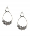 Hip hoop hooray! Featuring a unique oval double-drop silhouette, Jessica Simpson's earrings will stand out as a trendy addition to your wardrobe. Embellished with glittering glass accents, they're set in silver tone mixed metal. Approximate drop: 3 inches.