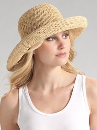 Packable wide brim style is hand-crocheted of natural raffia with an adjustable sizing cord. About 4 brim One size fits most Imported
