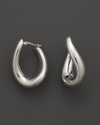 With a languid twist, a beautifully rendered hoop earring in polished 14 Kt. white gold. With a languid twist, a beautifully rendered hoop earring in polished 14 Kt. white gold.