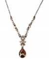 Perfect sparkle for any occasion. This Givenchy Y necklace flaunts rich hues with silk Swarovski stone pendants and accents. Crafted in brown gold tone mixed metal. Approximate length: 16 inches. Approximate drop: 1-3/4 inches.