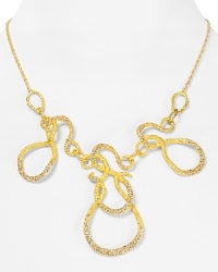 Go bold and oh so beautiful with this striking statement necklace from Alexis Bittar. Cast in 18-karat gold plate with Swarovski crystal accents, it puts a cool twist on every look. Go bold and oh so beautiful with this striking statement necklace from Alexis Bittar. Cast in 18-karat gold plate with Swarovski crystal accents, it puts a cool twist on every look.