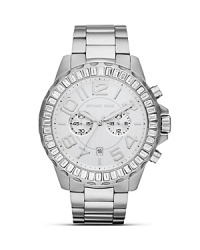 Make a sporty statement wit this sleek, stainless steel watch from MICHAEL Michael Kors. Boating an oversized bezel and glitzy accents, it will add easy impact to every look. Make a sporty statement wit this sleek, stainless steel watch from MICHAEL Michael Kors. Boating an oversized bezel and glitzy accents, it will add easy impact to every look.