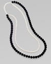 From the Night Blue Collection. This high contrast piece features strands of flocked velvet beads and pearlized glass beads. Length, about 45½ Slip-on style Imported 