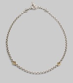 A bold sterling silver chain is accented by cloverleaf shapes of 18k gold in front and sterling silver at the closure. Sterling silver and 18k yellow gold Length, about 18 Toggle closure Made in Greece