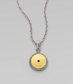 From the Shield Collection. An aptly named disc pendant of hammered 24k gold sits in a richly granulated frame of sterling silver with a faceted black spinel stone at its center.Black spinelSterling silver and 24k yellow goldAdjustable chain length, about 16-18Pendant diameter, about ¾Hook claspImported