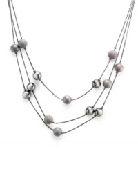The lightweight look of Alfani's three-row illusion necklace is anchored by spherical shaped details. Made in hematite tone mixed metal. Approximate length: 20 inches + 3-1/2-inch extender. Approximate drop: 4-1/2 inches. The lightweight look of Alfani's three-row illusion necklace is anchored by spherical shaped details. Made in hematite tone mixed metal. Approximate length: 20 inches + 3-1/2-inch extender. Approximate drop: 4-1/2 inches.