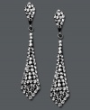 It's a black tie affair. Kaleidoscope's elegant tie-shaped drop earrings shine feature round-cut smokey crystals. Set in sterling silver with Swarovski elements. Approximate drop: 1-1/2 inches.