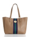 Signature detailing and a classic striped center give this Tommy Hilfiger Tote the perfect everyday style. Goldtone hardware and a roomy shape ensure this design will be a staple for seasons to come.