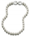 Add a taste of timeless glamour to your wardrobe with this radiant glass pearl (10 mm) necklace. Set in rhodium-plated silvertone mixed metal. Measures approximately 18 inches long.