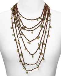 Discover your taste for exotic-chic with this layered necklace from Lauren by Ralph Lauren. Crafted from antiqued 14-karat gold plate, wood, and resin beads, it's sure to attract wandering eyes. Discover your taste for exotic-chic with this layered necklace from Lauren by Ralph Lauren. Crafted from antiqued 14-karat gold plate, wood, and resin beads, it's sure to attract wandering eyes.