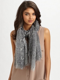 Lush silk and modal is embellished with a python print and fringed edges.50% wool/33% silk/17% cashmereAbout 70 X 55Dry cleanMade in Italy Lush silk and modal is embellished with a python print and fringed edges.50% wool/33% silk/17% cashmereAbout 70 X 55Dry cleanMade in Italy